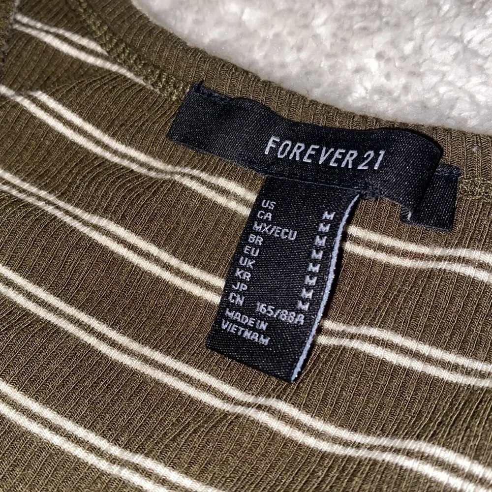 Forever 21 stripper long sleeve with tie at bottom left. - Picture 3 of 3